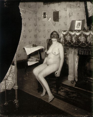 E.J. Bellocq's photograph of Storyville prostitute with mask
