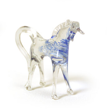 When we entered the room I opened my gift and saw the little glass horse