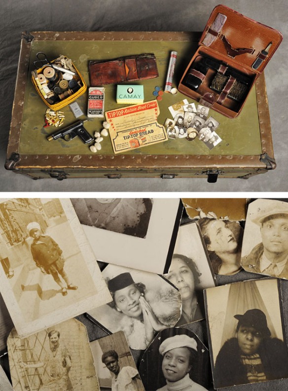 Abandoned suitcase with old family photographs, buttons, wallet, and Camay soap.
