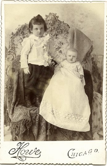 Victorian photograph of a child with mother disguised in the background.