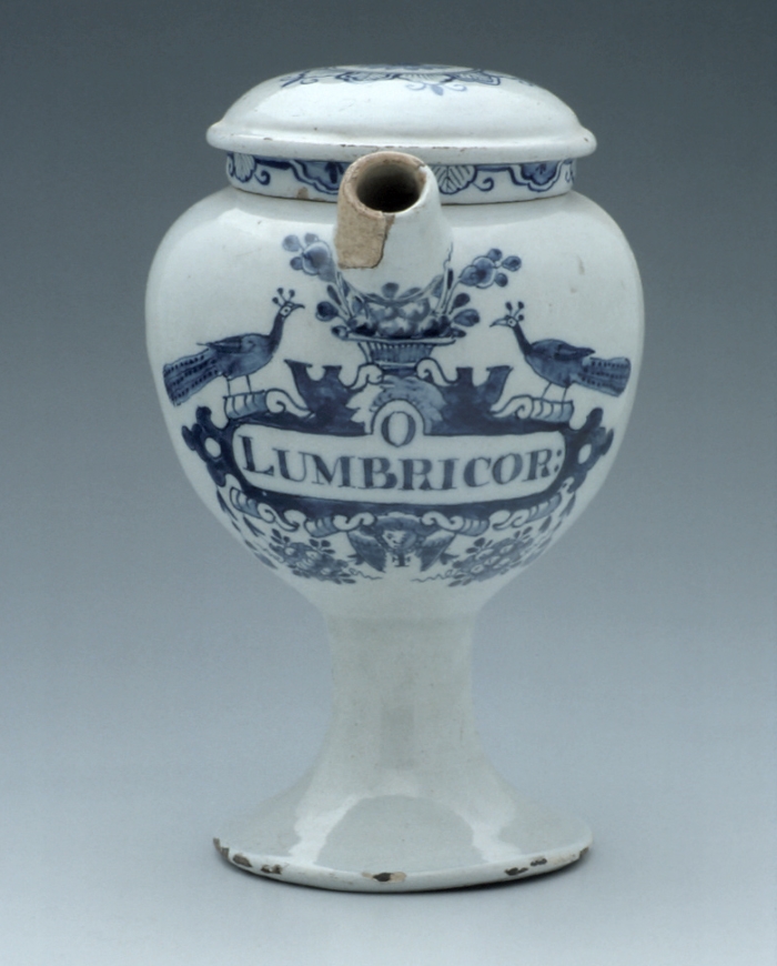 Blue and white ceramic jar with blue decoration of peacocks and a basket of fruit, inscribed Lumbricor