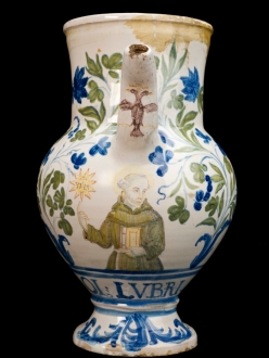 Syrup jar for oil of earthworms, with image of Saint Ignatius painted above words OL.LUBRI